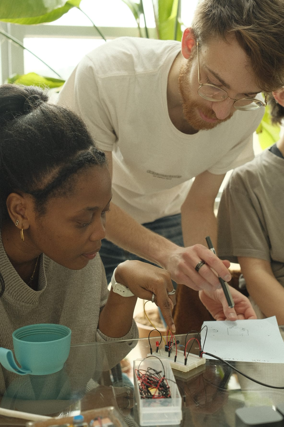 People collaborating at a workshop table